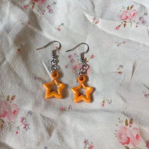 iridescent orange star earrings
